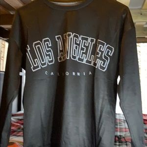 Black Long-sleeve, White writing "Los Angeles"